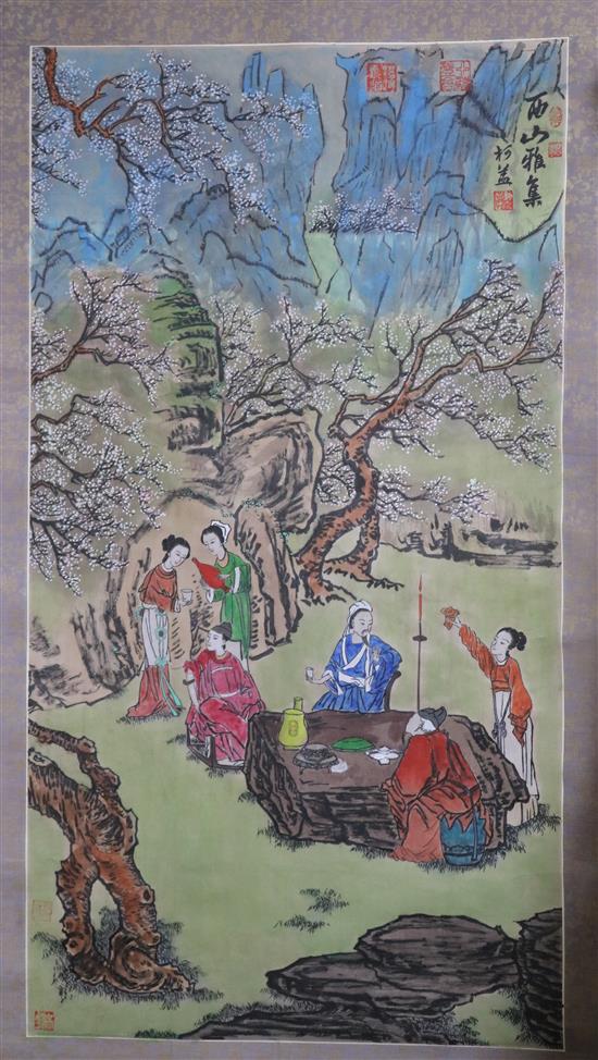 A Chinese scroll painting of figures in a landscape